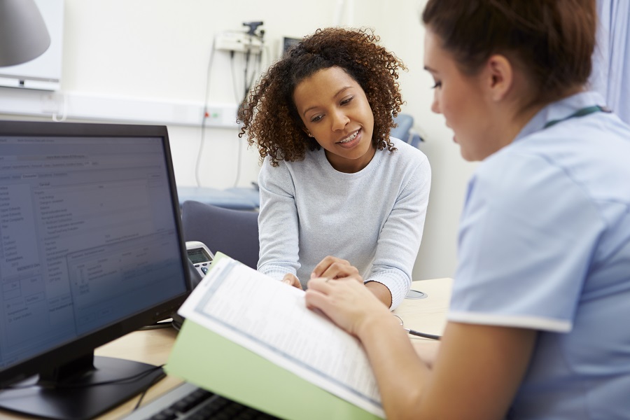 Nurse Discussing Test Results With Patient Nurse Discussing Test Results With Patient